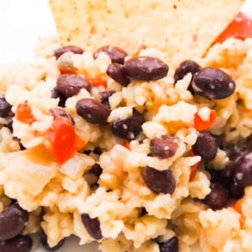 Up close picture of bean and rice casserole on a chip.