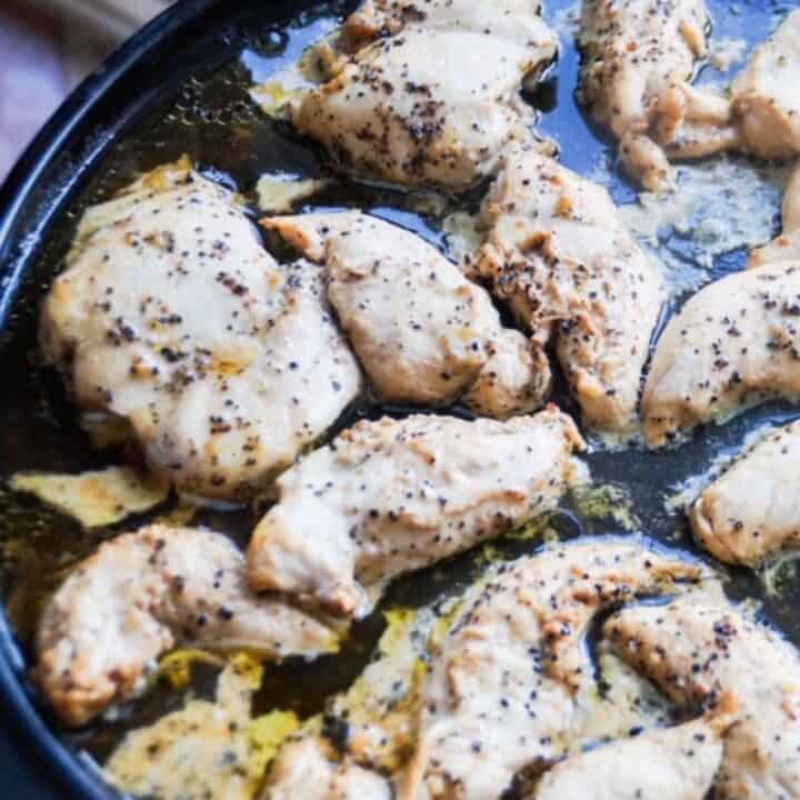Cooked lemon pepper chicken pieces.