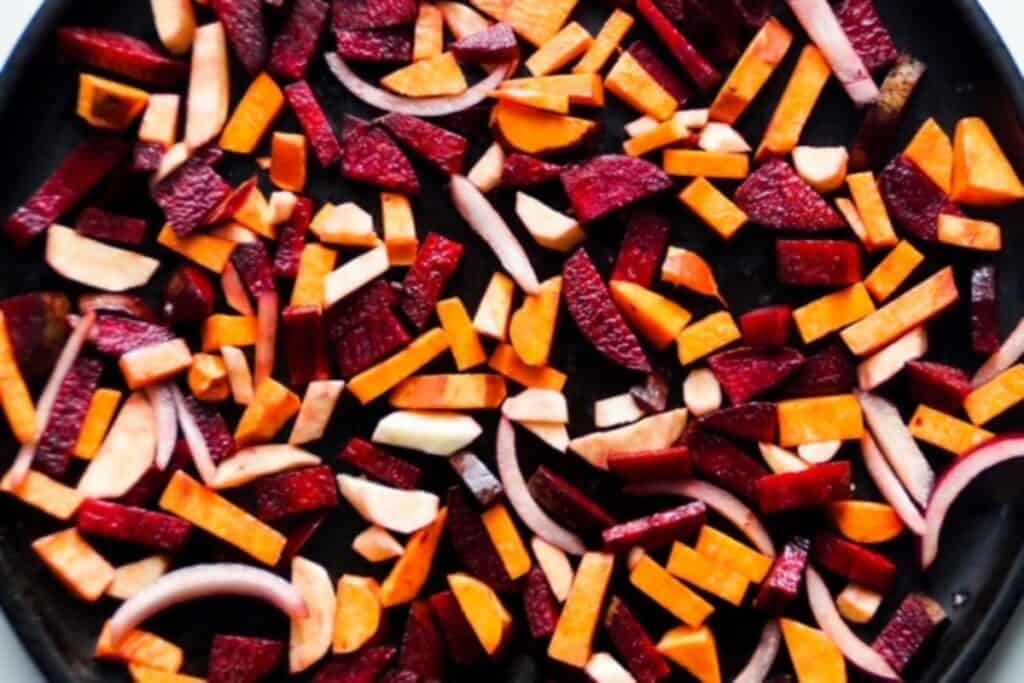 cut up root vegetables on a pan