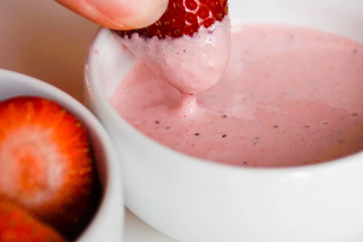 strawberry dipped in strawberry cream cheese dip