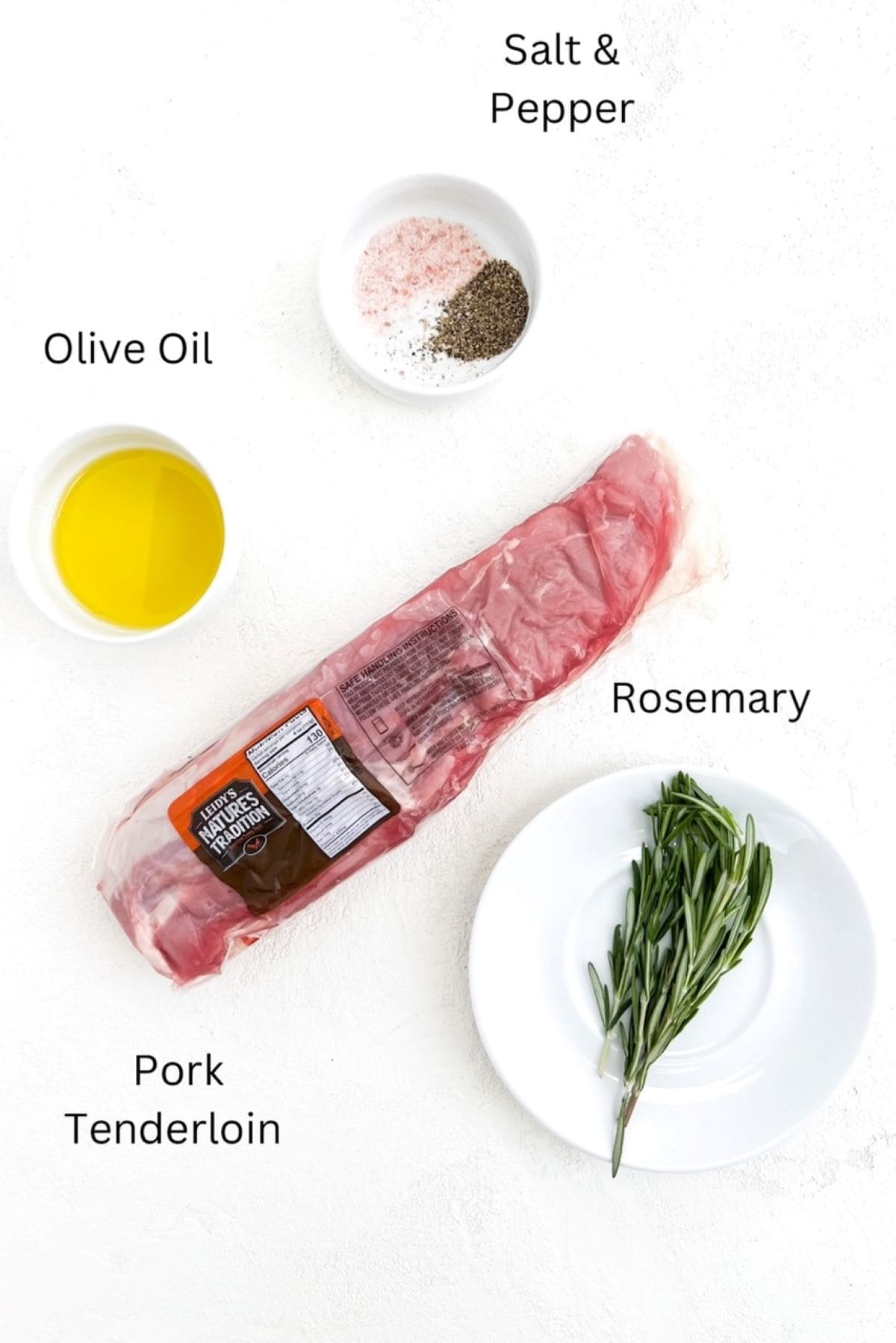 One pork tenderloin in it's package with olive oil, salt and pepper, and fresh rosemary in separate white dishes.