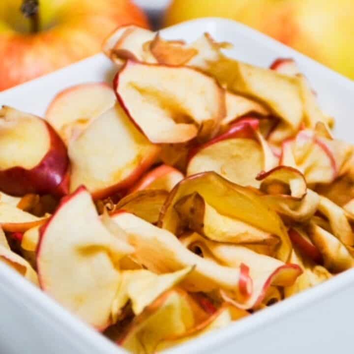 air fried apple slices in a square white bowl