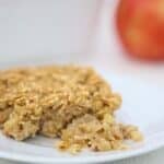 One piece of Baked Oatmeal with Apples and Cinnamon on a white plate.