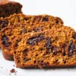 Three slices of pumpkin chocolate chip bread overlapping.