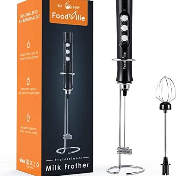 One FoodVille milk frother set in it's stand with the whisk attachment to the right of it and the box it came in to the left of it.
