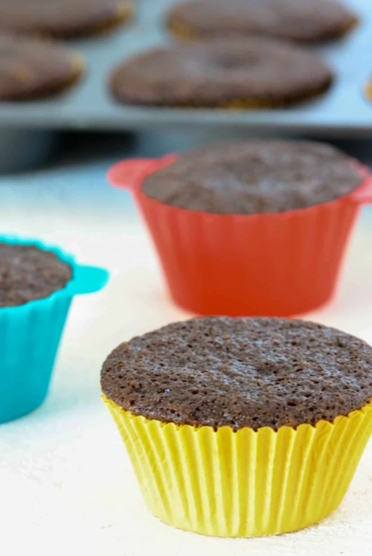 Easy dairy free chocolate cupcakes in colorful cupcake liners.