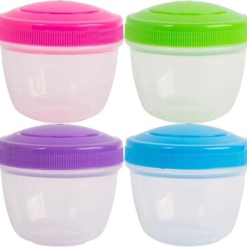 Four plastic snack containers with screw top lids, each with a different color lid.