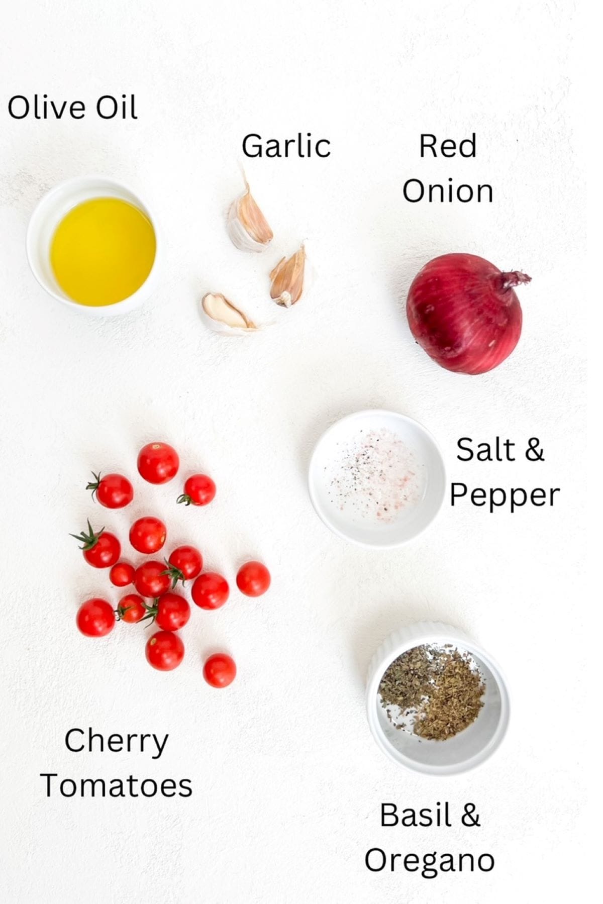 Olive oil, three garlic cloves, one red onion, cherry tomatoes, salt and pepper, basil and oregano placed separately on a white background and labeled.