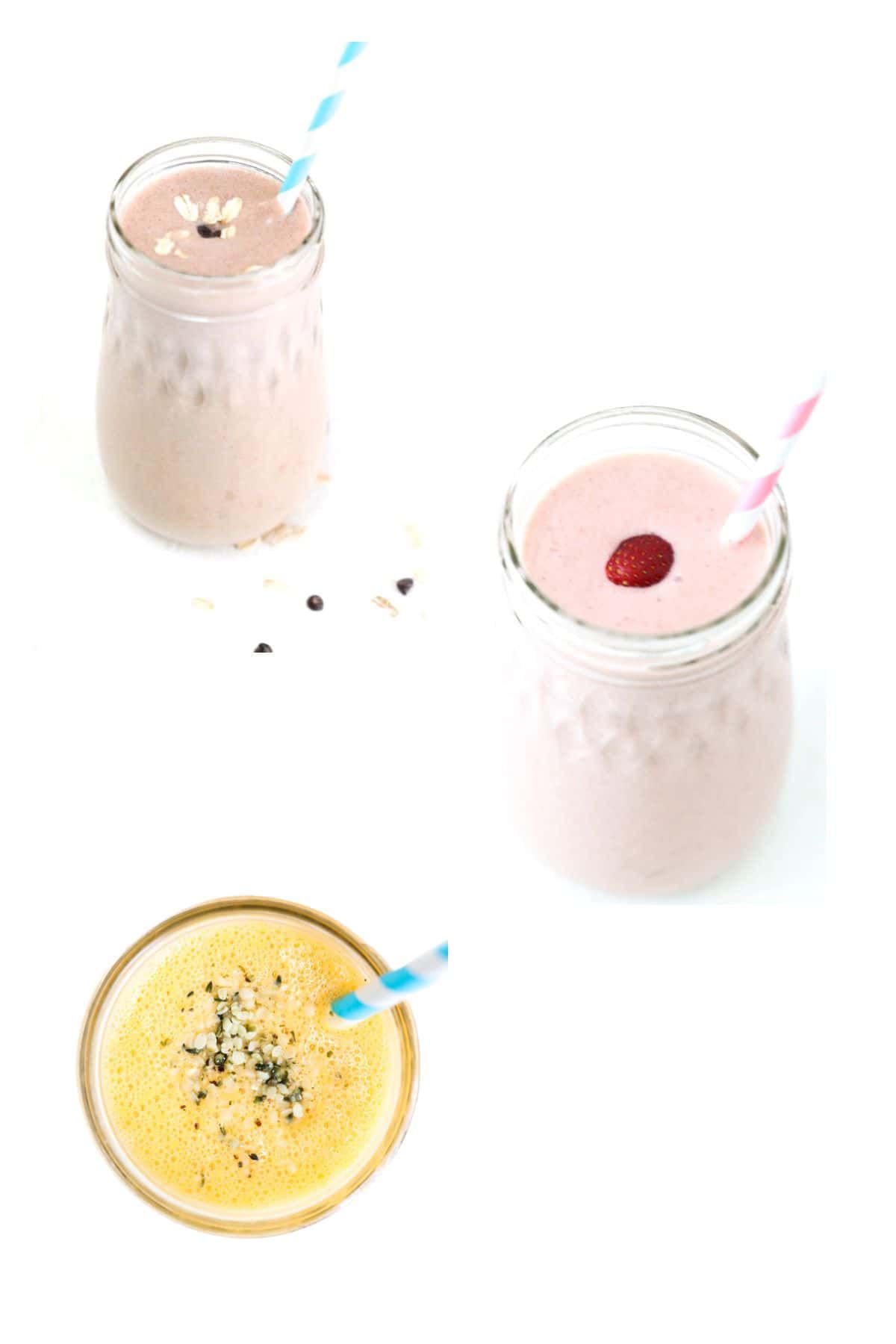 Three different smoothies in glass jars with straws.