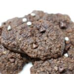 Double chocolate chip banana cookies on a white plate.